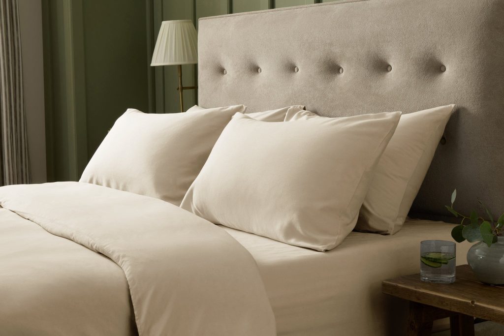 Simba Brushed Tencel Pillowcase Pair on a made bed in a bedroom