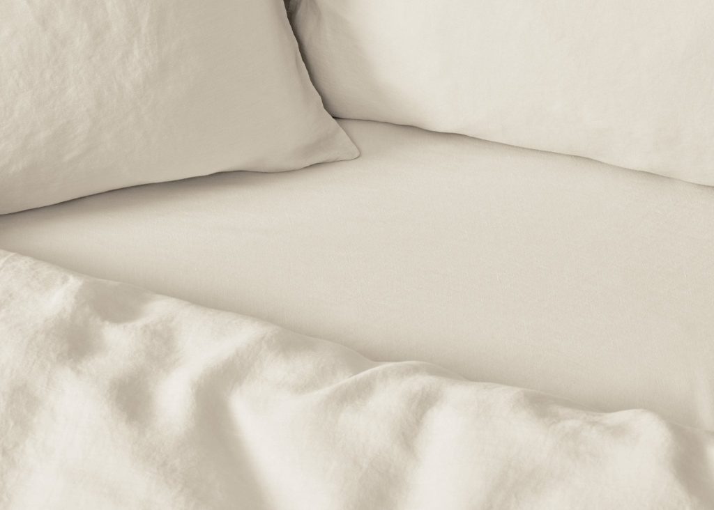Simba Cool Linen Fitted Sheet on a made bed, close view of the fabric