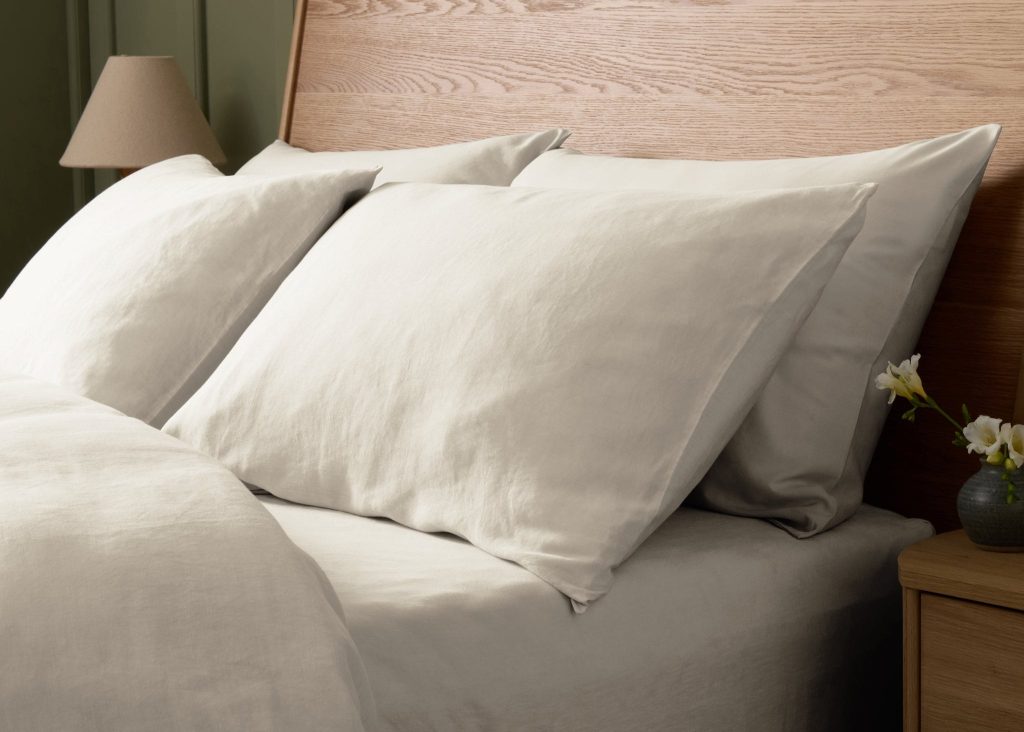 Simba Cool Linen Pillowcase Pair on a made bed in a bedroom