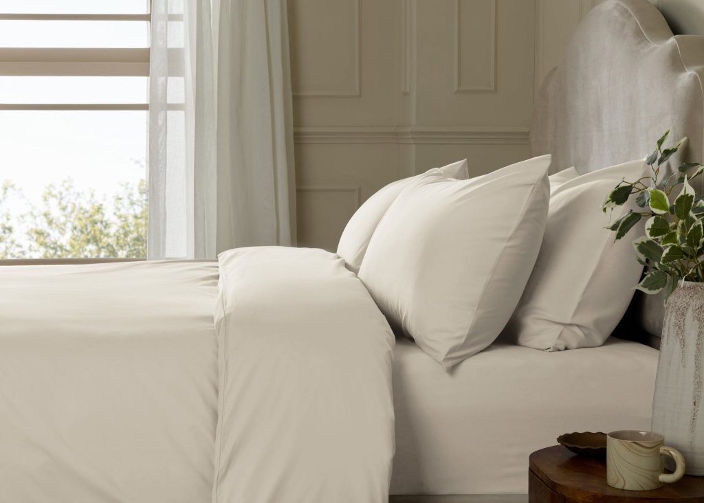 Simba Cotton Percale Bedding Set on a made bed in a bedroom