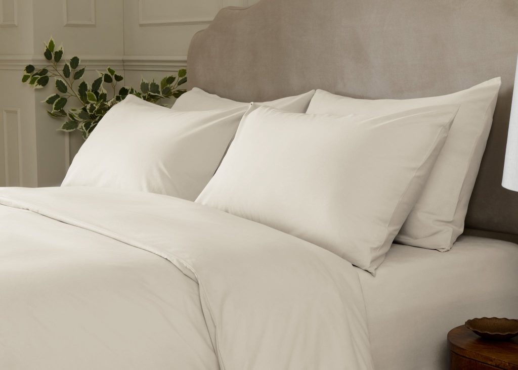 Simba Cotton Percale Pillowcase Pair on a made bed in a bedroom