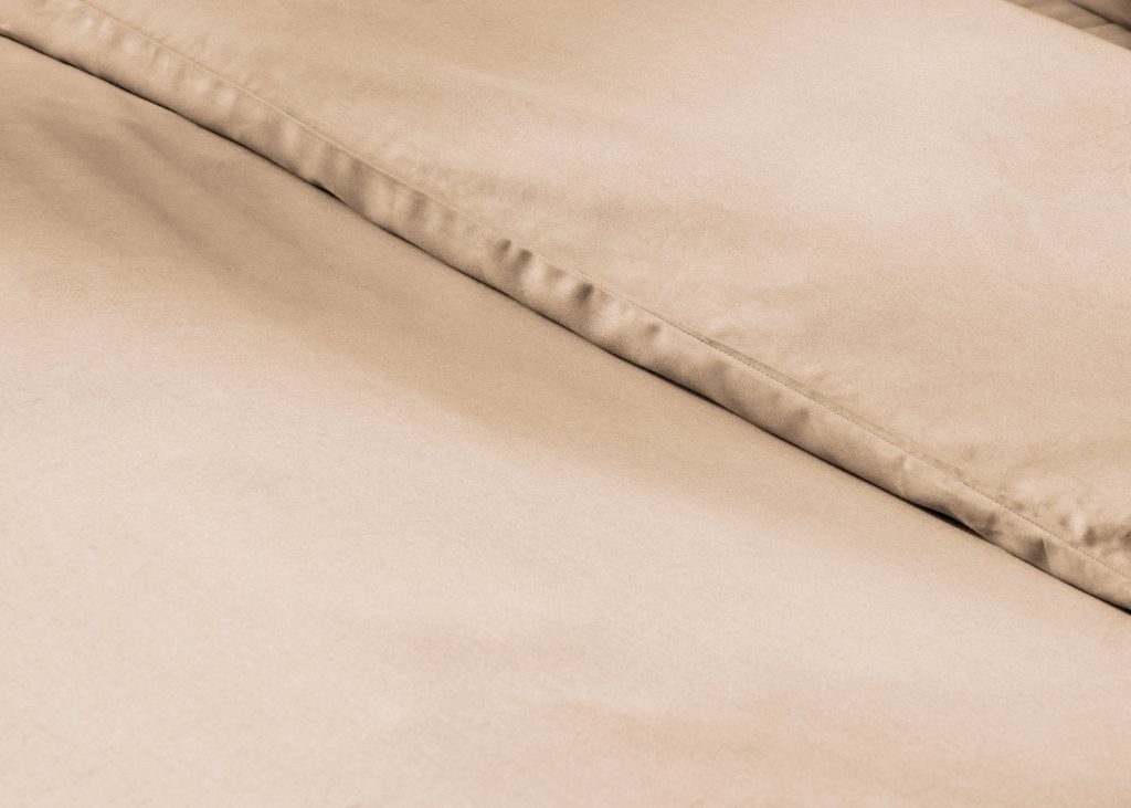 Simba Egyptian Cotton Duvet Cover on a made bed, close view of the fabric