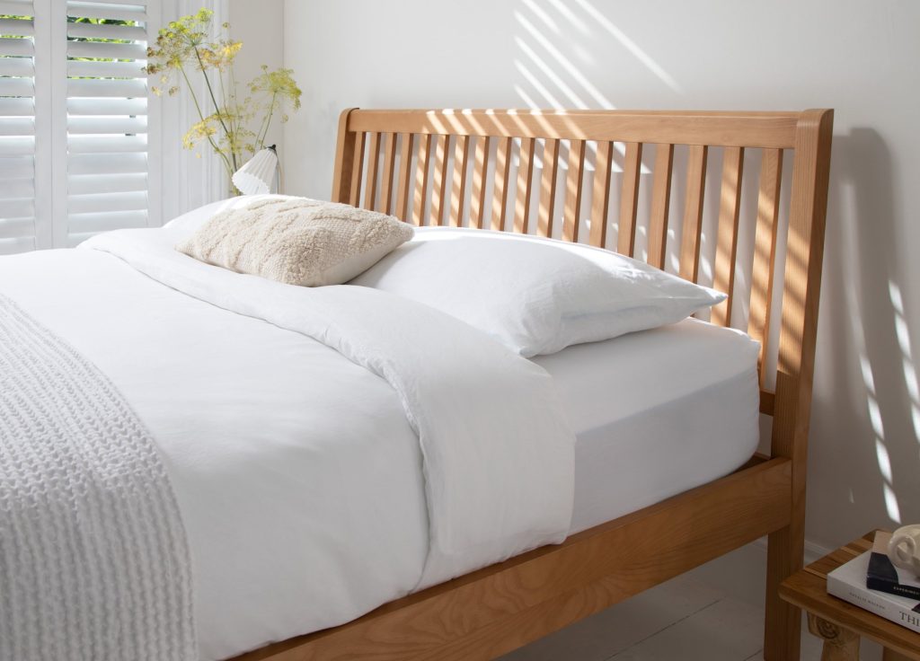 Simba Sherwood Solid Ash Bed, the slatted ash headboard behind white pillows