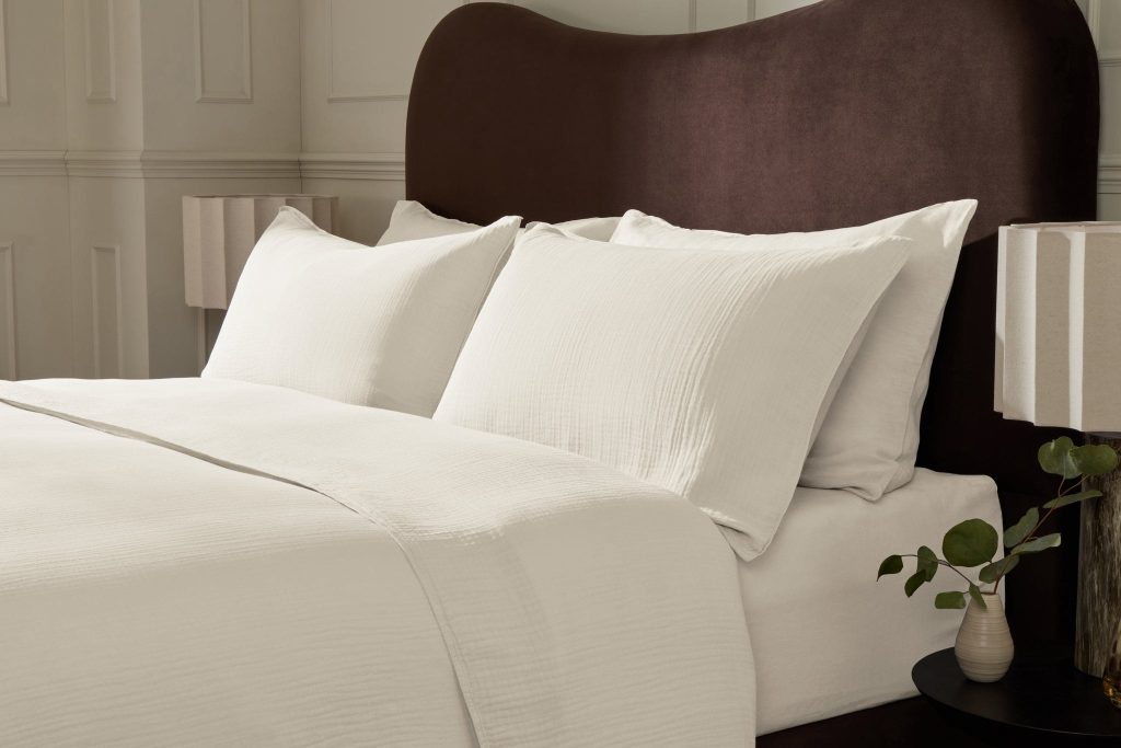 Simba Soft Muslin Pillowcase Pair on a made bed in a bedroom