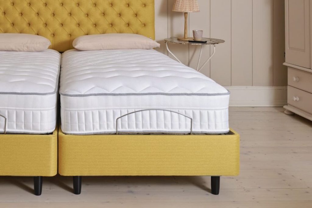 Sleepeezee InMotion Eco mattress bending with the raised head section of an adjustable divan