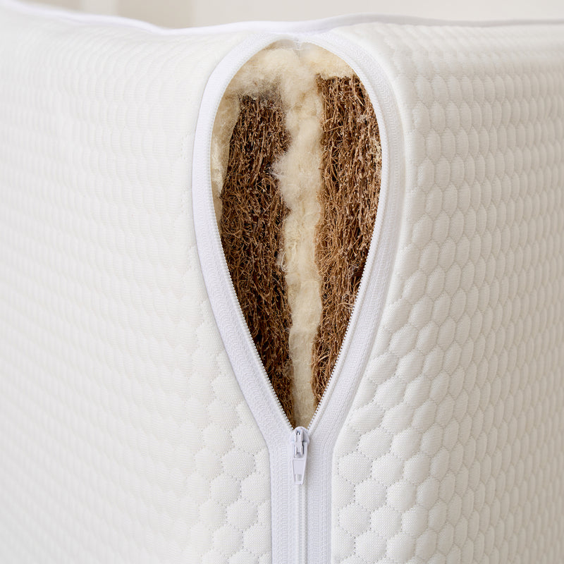 Tiny Dreamer Natural cover opened to show the coconut coir core between wool layers
